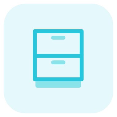 Çift çekmeceli komodin ya da dolap.