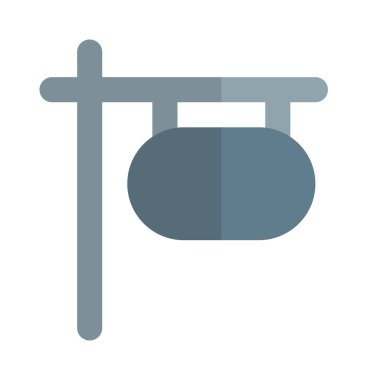 Yol kenarı tabelasını destekliyor.