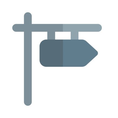 Yol işareti yön oku ile asılıyor.