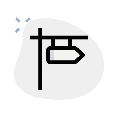 Yol işareti yön oku ile asılıyor.