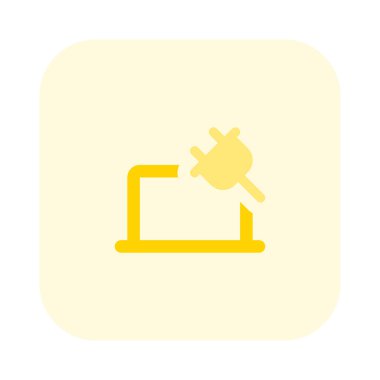 Şarj kablosuyla dizüstü bilgisayar çalıştırılıyor.