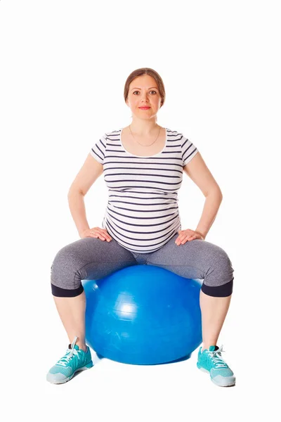 stock image Pregnancy exercise concept - pregnant woman doing exercises with exercise ball isolated on white background