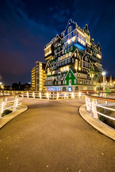 stock image ZAANDAM, NETHERLANDS - MAY 21, 2018: Inntel Hotel in Zaandam illuminated at night. Design of 12-storey tall building opened in 2009 is the result of stacking a series of traditional Dutch houses