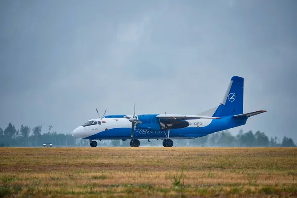 stock image MINSK, BELARUS - JUNE 15, 2018: Genex cargo flight Antonov An-26B plane preparing to take-off on runway in National Airport Minsk