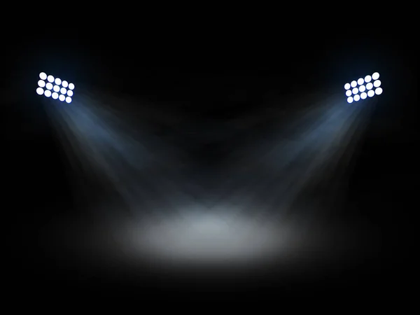 スタジアムシアターは黒の背景に光ビームを持つスポットライトを浮かび上がらせます — ストック写真