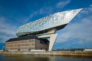 ANTWERP, BELGIUM - MAY 27, 2018: Port authority house (Porthuis) designed by famous Zaha Hadid Architects which was her last project clipart