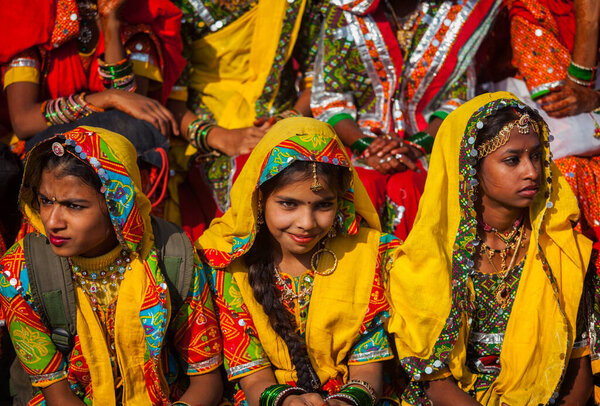 PUSHKAR, INDIA - NOVEMBER 21, 2012: Unidentified Rajasthani girls in traditional outfits prepare for dance perfomance at annual camel fair Pushkar Mela in Pushkar, Rajasthan, India