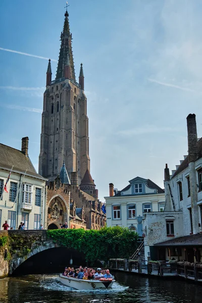 Bruges Belgium May 2018 Tourist Boat Tourists Canal Church Our — Stock Photo, Image