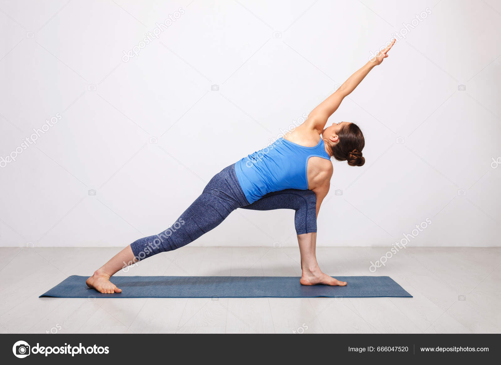 Woman Doing Ashtanga Vinyasa Yoga Asana Parivrtta Parsvakonasana Revolved  Side Stock Photo by ©DmitryRukhlenko 666047520