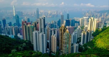 Gün batımında Victoria Tepesi 'nden Hong Kong gökdelenlerinin gökdelenlerini gösteren zaman çizelgesi. Hong Kong, Çin