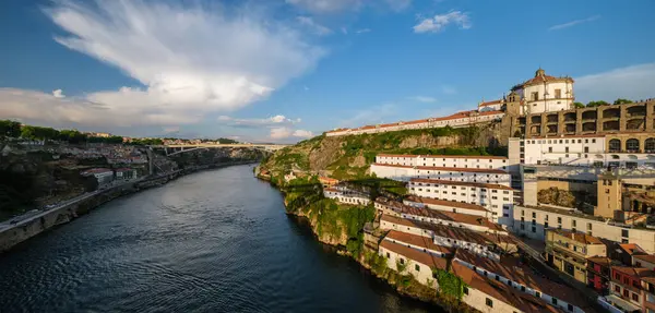 stock image Panorama of Vila Nova de Gaia city with Mosteiro da Serra do Pilar monastery and Douro river on sunset. Porto, Vila Nova de Gaia, Portugal