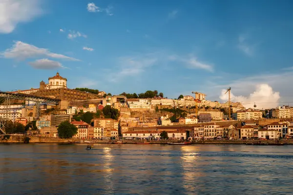 stock image View of Vila Nova de Gaia city riverfront with Mosteiro da Serra do Pilar monastery and Dom Luis I bridge over Douro river on sunset. Porto, Vila Nova de Gaia, Portugal