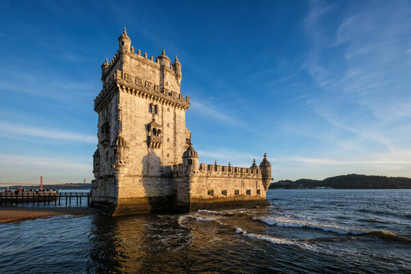 Belem Tower or Tower of St Vincent - famous tourist landmark of Lisboa and tourism attraction - on the bank of the Tagus River Tejo on sunset. Lisbon, Portugal