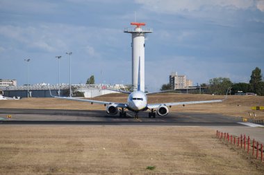 Lisbon, Portugal - September 2, 2023: Ryaniar Boeing 737-8AS passenger plane waiting for take off on runway in Humberto Delgado Airport in Lisbon clipart