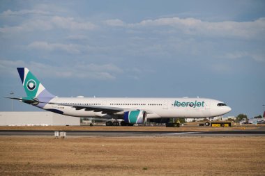 Lisbon, Portugal - September 2, 2023: Iberojet Airbus A330-941 passenger plane taxi on runway in Humberto Delgado Airport in Lisbon clipart