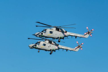 Oeiras, Portugal - September 30, 2023: Two Westland Lynx military helicopters of Portuguese Navy demo flight at Oeiras Air Show