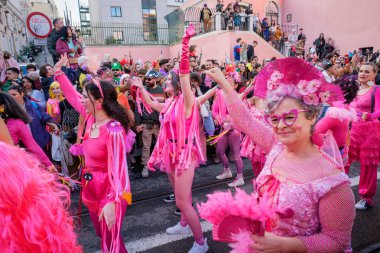 Lisbon, Portugal - February 24, 2024: Carnival parade in streets of Lisbon by artistic collective Clandestine Colombina clipart