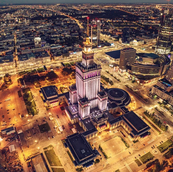 stock image Aerial view on Palace of Science and Culture in Warsaw. View from above to the modern city center with illumination
