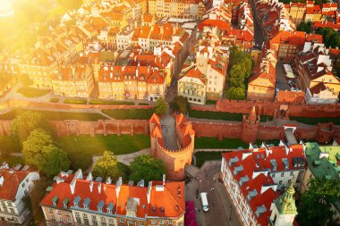 Old city in Warsaw with red roofs, Poland from above. Travel outdoor european background with wall and barbacan