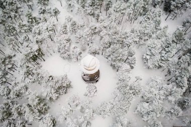 Old observatory tower in the Glen park. Tallinn, Estonia. Winter seasonal landscape. View from above clipart