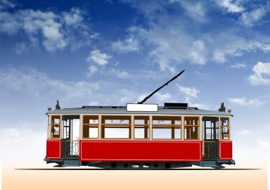 Kırmızı ve bej renkli eski tramvay mavi gökyüzünün altından geçiyor.