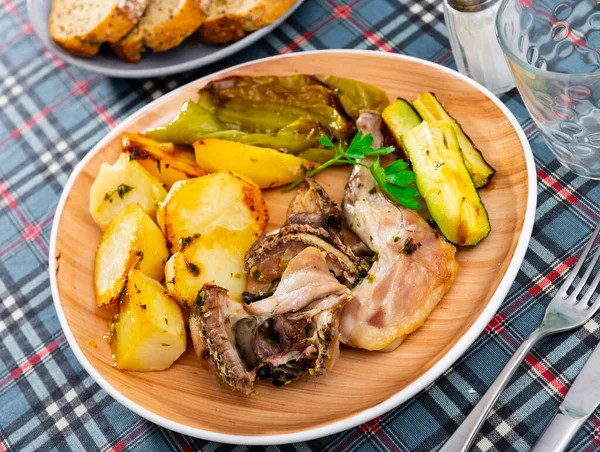 Appetizing Pieces Baked Rabbit Potatoes Vegetables Decorated Sprig Fresh Parsley — Stock Photo, Image