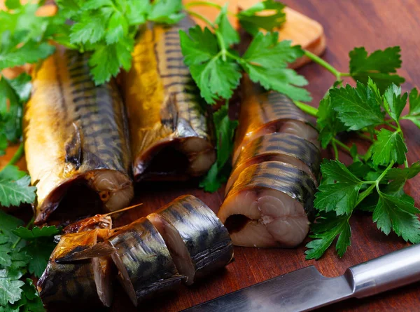 stock image Fragrant smoked mackerel fish sliced and garnished with parsley, mediterranean food