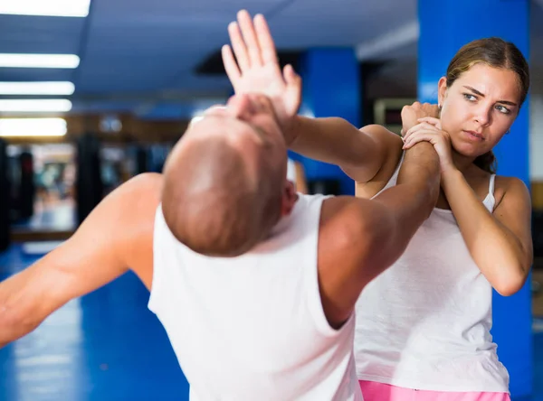 Concentrated Young Female Practicing Effective Self Defence Techniques Coach Training — Stock Photo, Image
