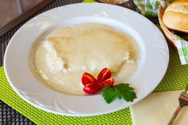 Dish of Slovenian cuisine, tasty chicken fillet in cream sauce at plate
