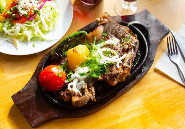 stock image Tasty and healthy grilled beef chop dinner served with vegetable garnish..