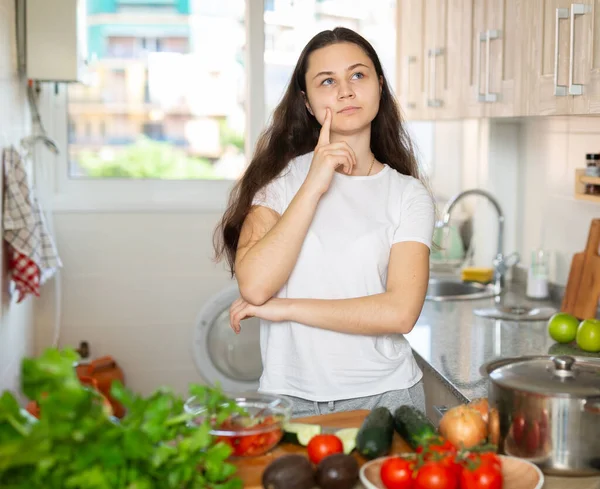 Pensive Young Brunette Woman Standing Kitchen Thinking Cooking — Stock Photo, Image