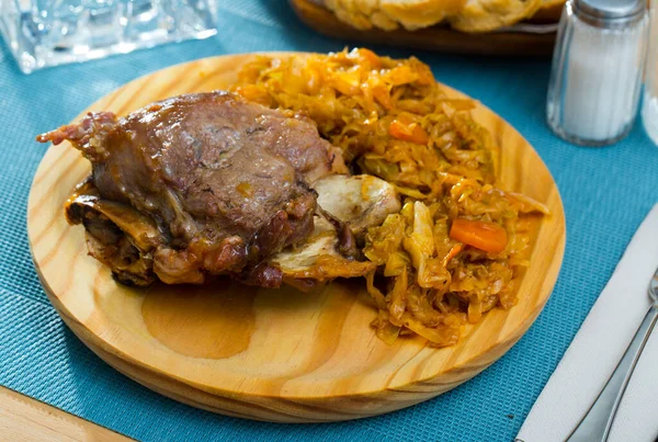 Pork cheeks with braised cabbage, original catalonian dish Galtas al horno