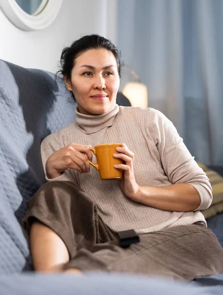 Asian Woman Sitting Couch Holding Cup Coffee Watching Home — Stock Photo, Image