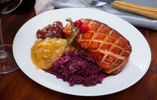 Delicious poultry dish - duck breast Magret with pickled cabbage, herbs and rosemary