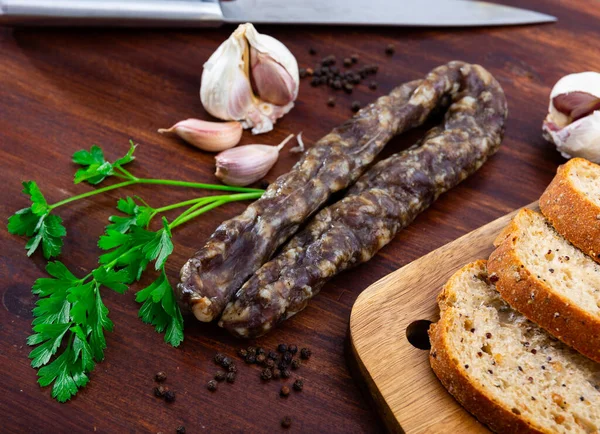 Delicious Dried Pork Sausage Wooden Cutting Board Garnished Fresh Parsley — Stock Photo, Image