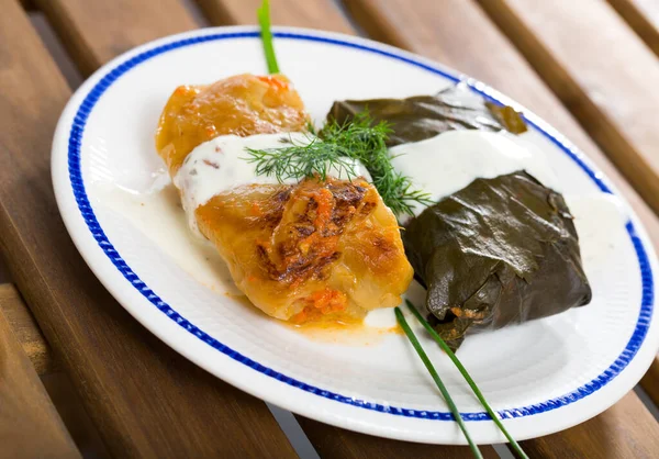 Tasty Stuffed Cabbage Grape Leaves Served Sour Cream Fresh Greens — Stock Photo, Image