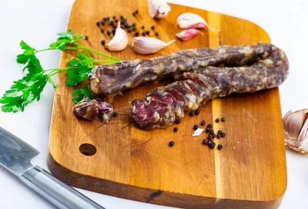 Appetizing Spanish Cured Pork Sausage Garlic Peppercorns Sprig Fresh Parsley — Stock Photo, Image
