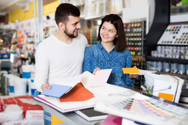 Glad Young Couple Examining Color Scheme Variants Paint Supplies Store — Stock Photo, Image