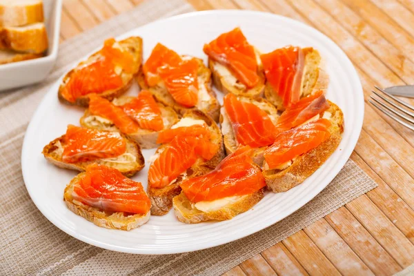 Closeup Appetizing Canapes Baguette Butter Fillets Salted Salmon Served White — Stock Photo, Image