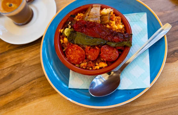 Stale bread based Spanish dish, migas, cooked with pepper and chorizo.