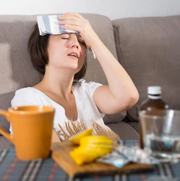 Woman Suffering Headaches Fever Sofa Home — Foto Stock