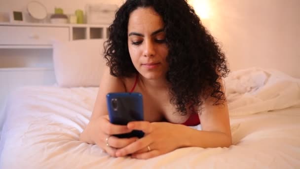 Portrait Young Positive Woman Lingerie Using Phone Lying Bed High — Stock Video
