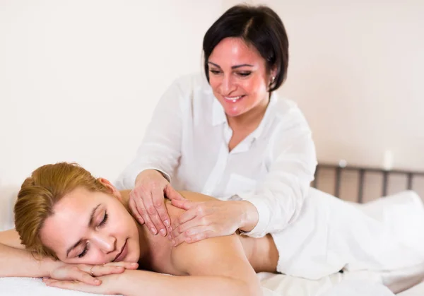 Mature Masseuse Doing Relaxing Massage Shoulder Area Young Woman Spa — Stok fotoğraf