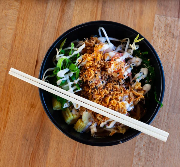 stock image Appetizing DIY style salad with fish and vegetables in Japanese fast food restaurant..