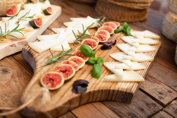 Sliced Hard Cheese Served Wooden Boards Fresh Aromatic Rosemary Basil — Zdjęcie stockowe