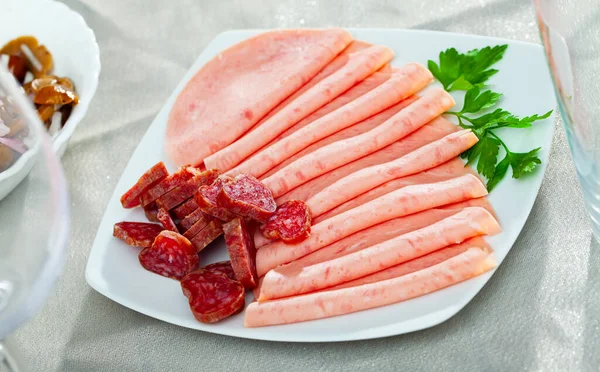Thin Sliced Mortadella Chorizo Pieces Served Plate Fresh Greens Popular — Stock Photo, Image