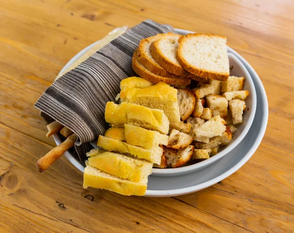 Slices Traditional Italian Bread Croutons Grissini Plate Wooden Table — Stock Photo, Image