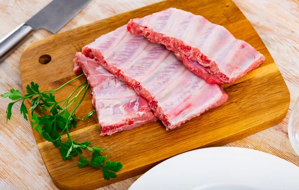 Raw Meaty Pork Ribs Slabs Fresh Greens Ready Cooking Wooden — Stock Photo, Image