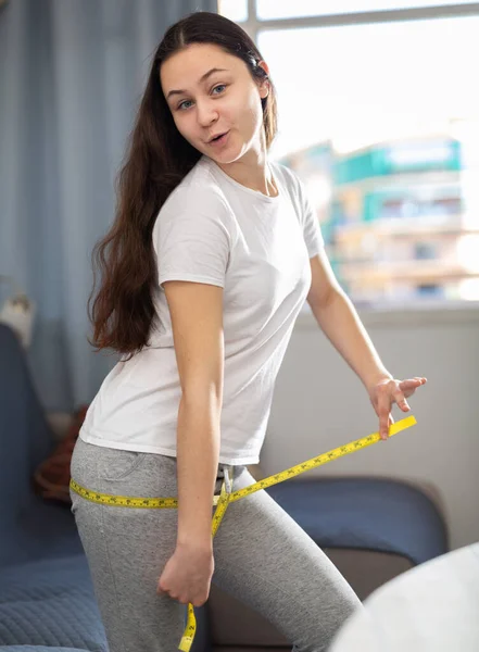 Positive Young Pretty Woman Measuring Thigh Measuring Tape Home — Stock Photo, Image