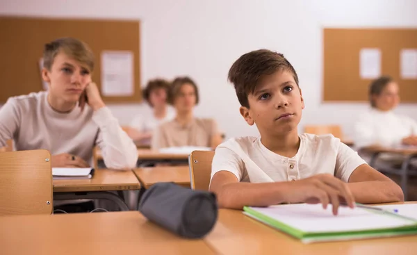 Portrait Upset Tired Teenage Schoolboy Sitting Classroom Secondary School Learning — Stock Photo, Image